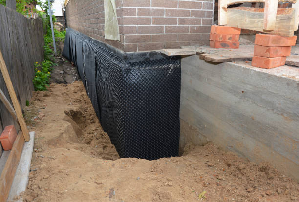 Happy homeowners after waterproofing job in Hammonton